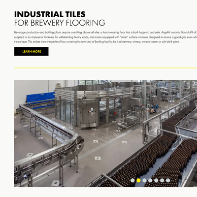 Industrial tile flooring ad with stainless steel brewery equipment and a black “LEARN MORE” button