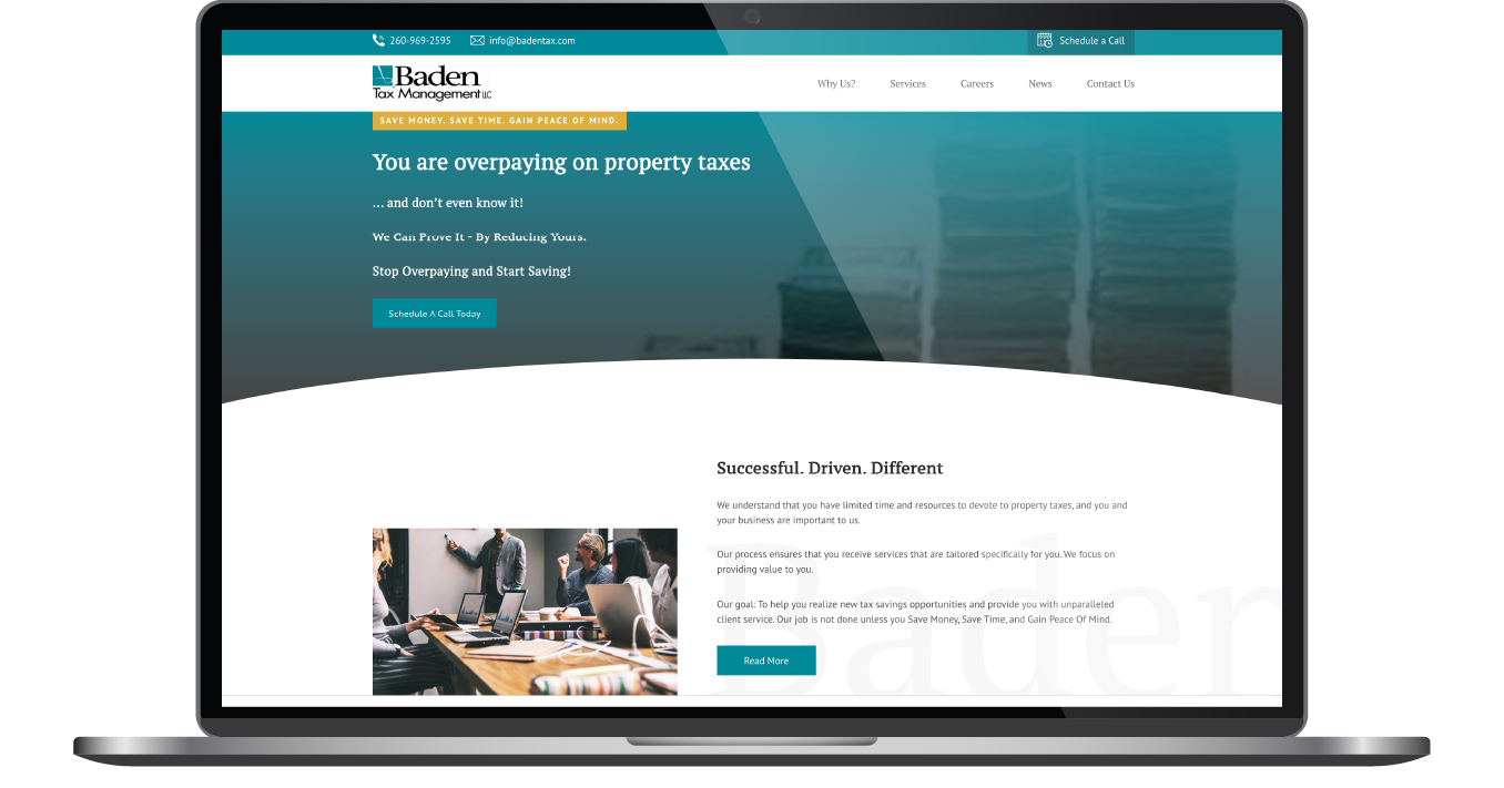 Laptop displaying a teal-and-white website homepage with a navigation bar and content section