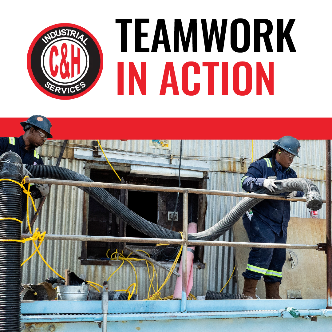 Two workers in hard hats handling hoses at a construction site under a “TEAMWORK IN ACTION” banner