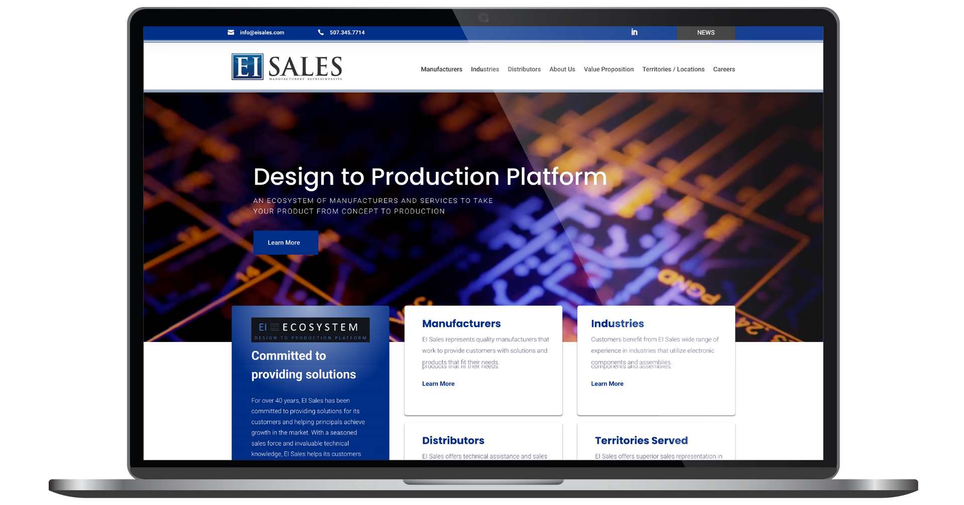 Laptop displaying a sales website with a blue-and-white header and a city-at-night background
