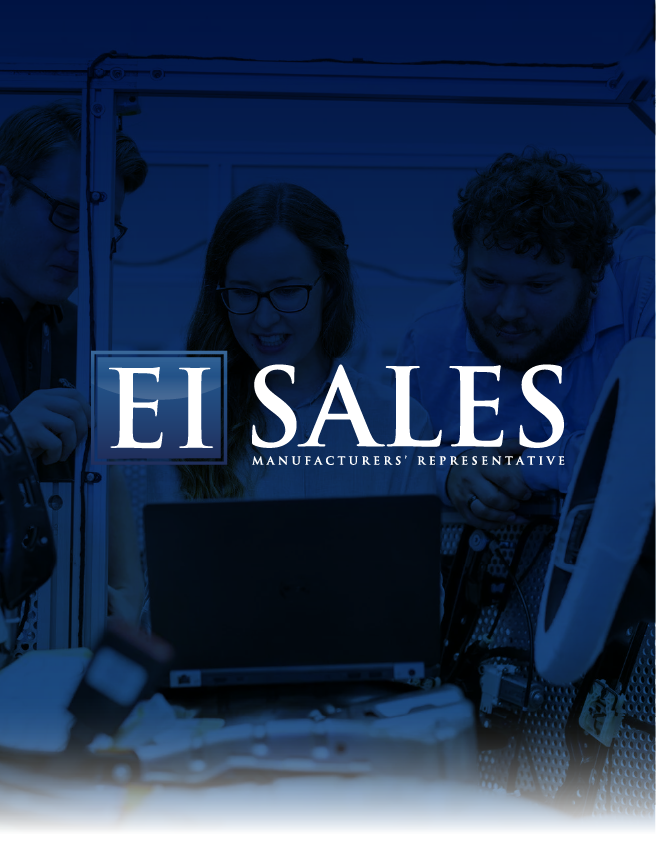 Two people behind a laptop with EL Sales logo and text, in a blue-tinted office setting