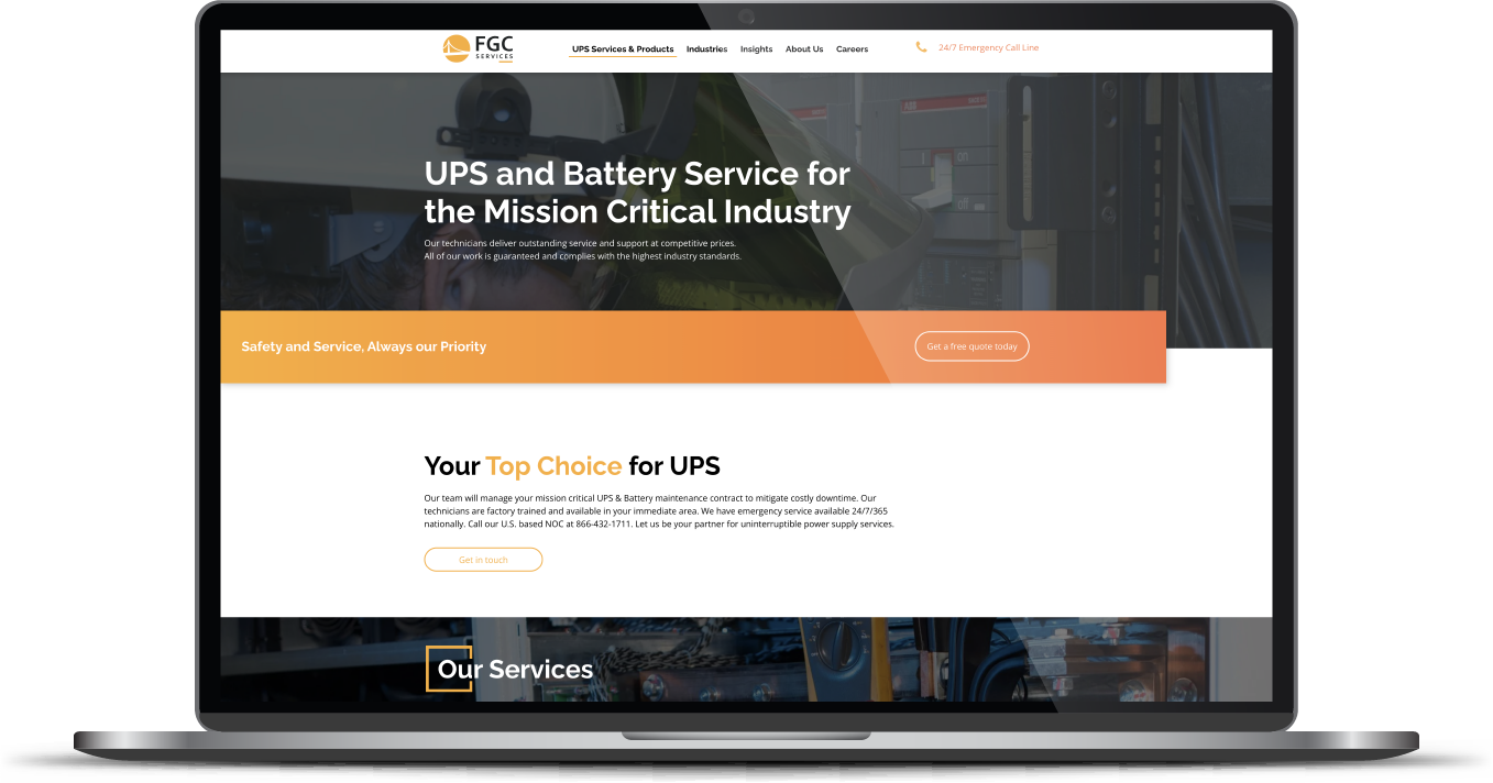 Laptop displaying a website with an orange banner and battery service message for the industrial sector