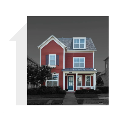 Two-story red house with white trim, front porch, and dormer windows in a suburban neighborhood