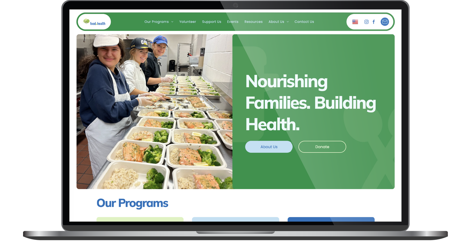 Laptop displaying a house exterior website with a large hero image and navigation menu