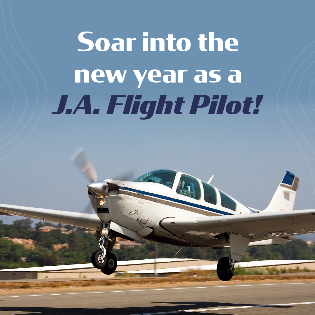 Small white-and-blue prop plane taking off with text: “Soar into the new year as a J.A. Flight Pilot!”