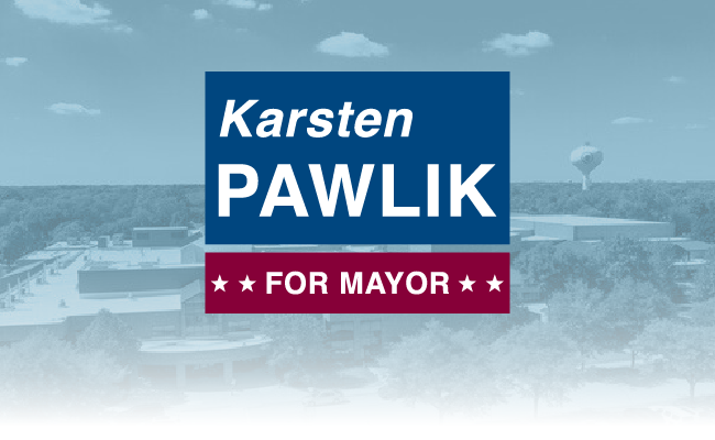 Karsten Pawlik campaign sign with blue background and red “For Mayor” banner over a cityscape.