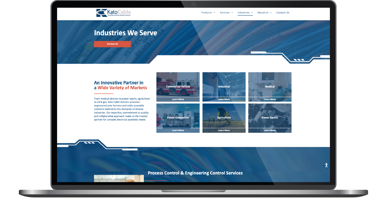 Laptop displaying a blue website homepage with a grid of content tiles and navigation bar