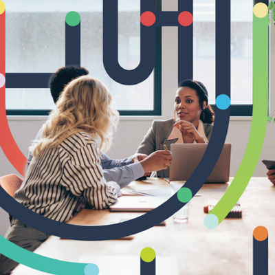 Three people in a meeting around a laptop, overlaid with colorful abstract lines and dots.