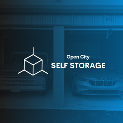 Open City Self Storage sign on a blue storefront with storage icon and car silhouettes