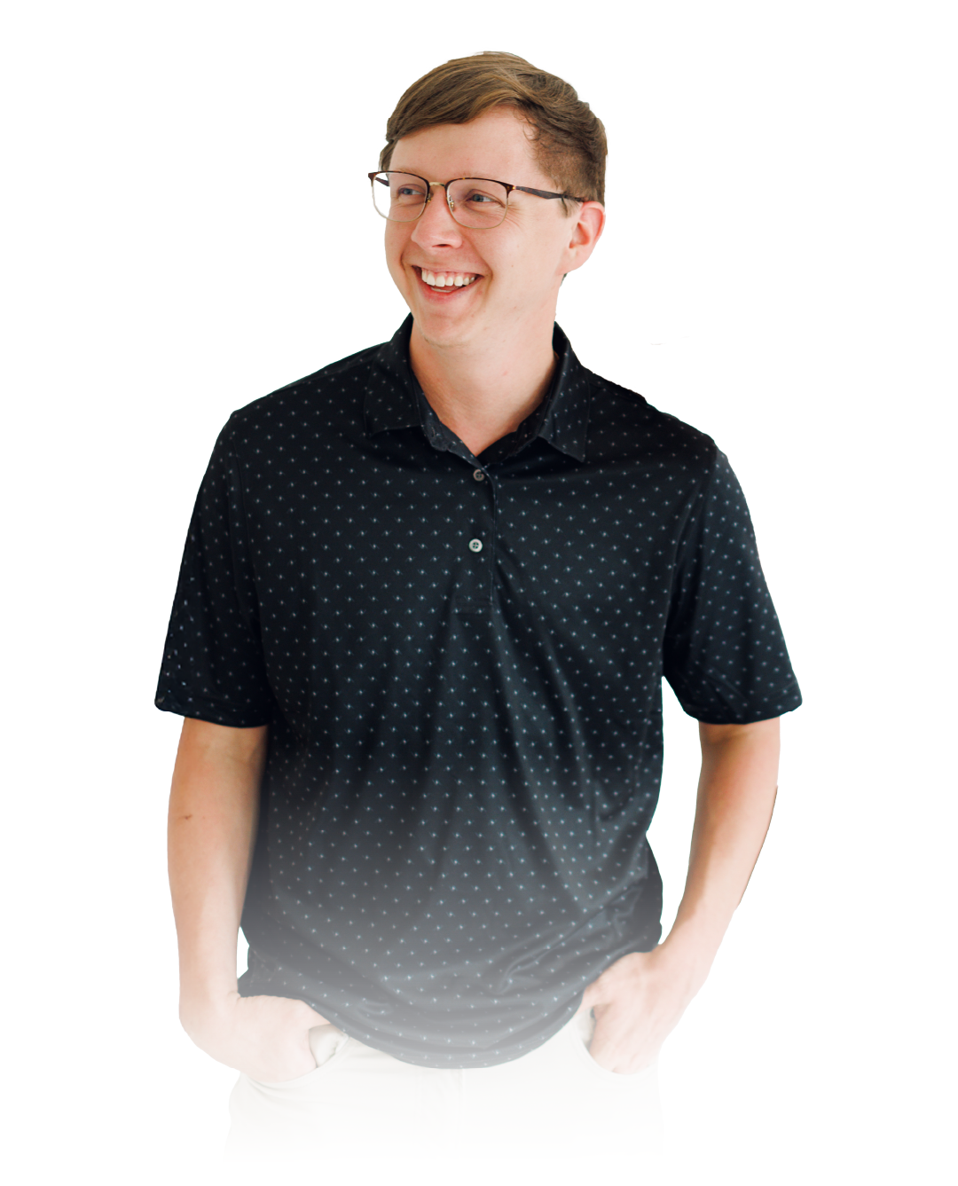 Smiling person in a black patterned polo shirt standing against a white background