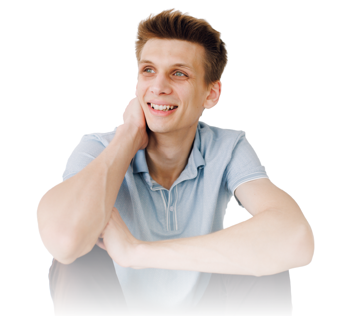 Smiling person in a light blue shirt resting their head on one hand against a white background