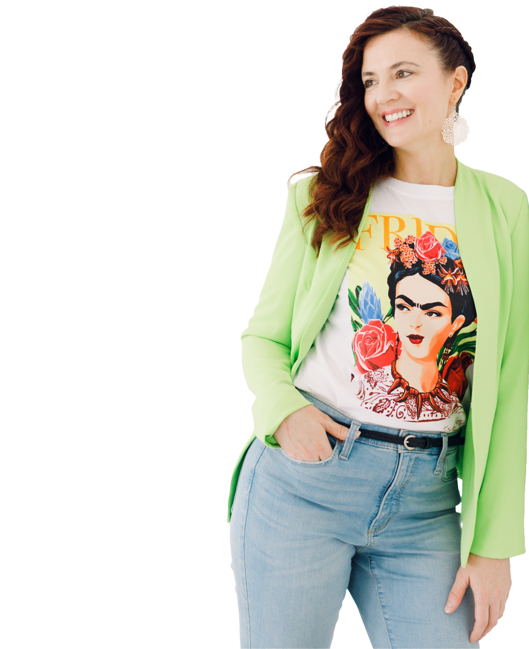 Woman in a lime green jacket and jeans wearing a Frida Kahlo graphic T-shirt, smiling and looking aside