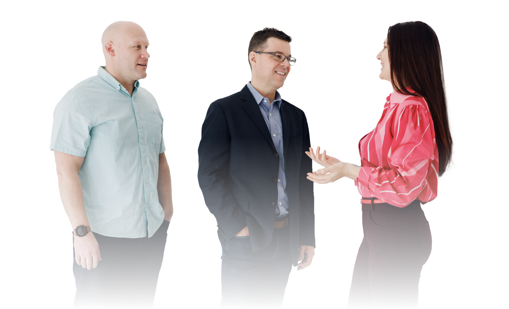 Three people in business attire talking in a bright white studio, one gesturing while the others listen.