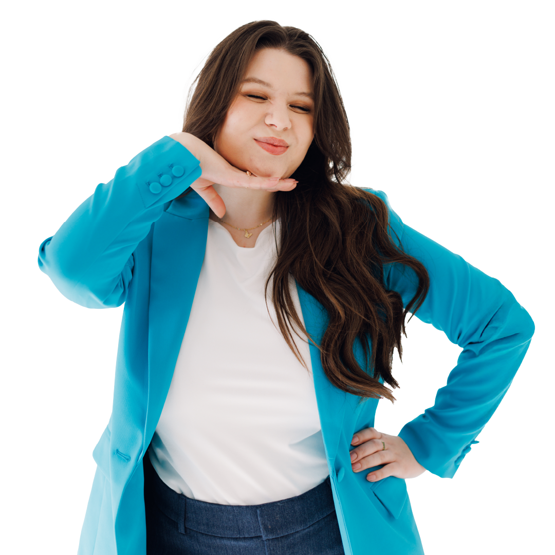 Woman posing playfully in a bright blue blazer, white top, and jeans against a white background