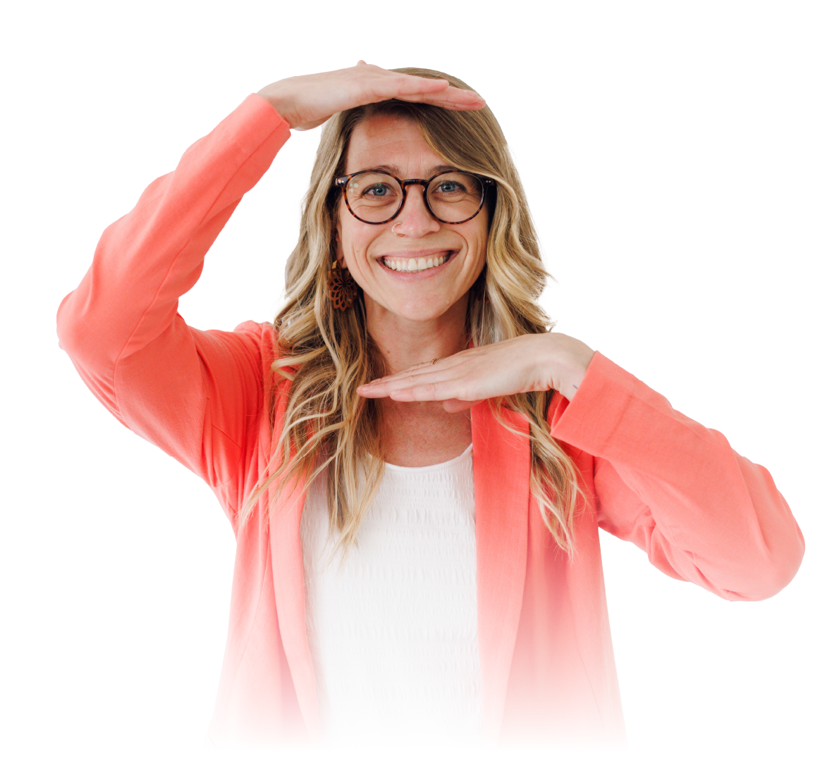 Smiling person in glasses and coral cardigan framing their face with hands against a white background