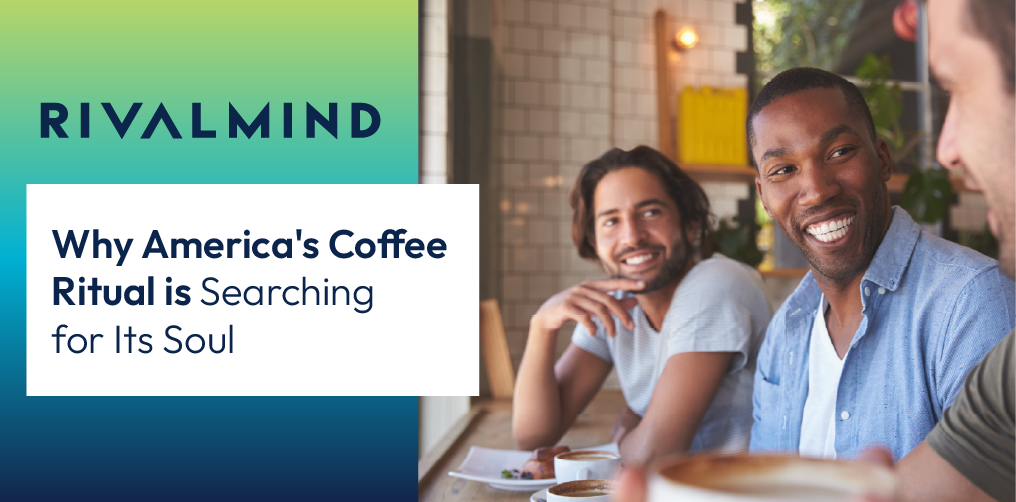 Several men enjoying a conversation and coffee at a coffee shop.