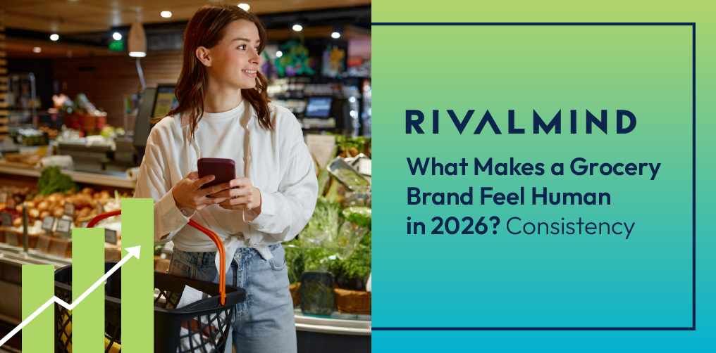 A young woman at the grocery store using her phone to check prices.