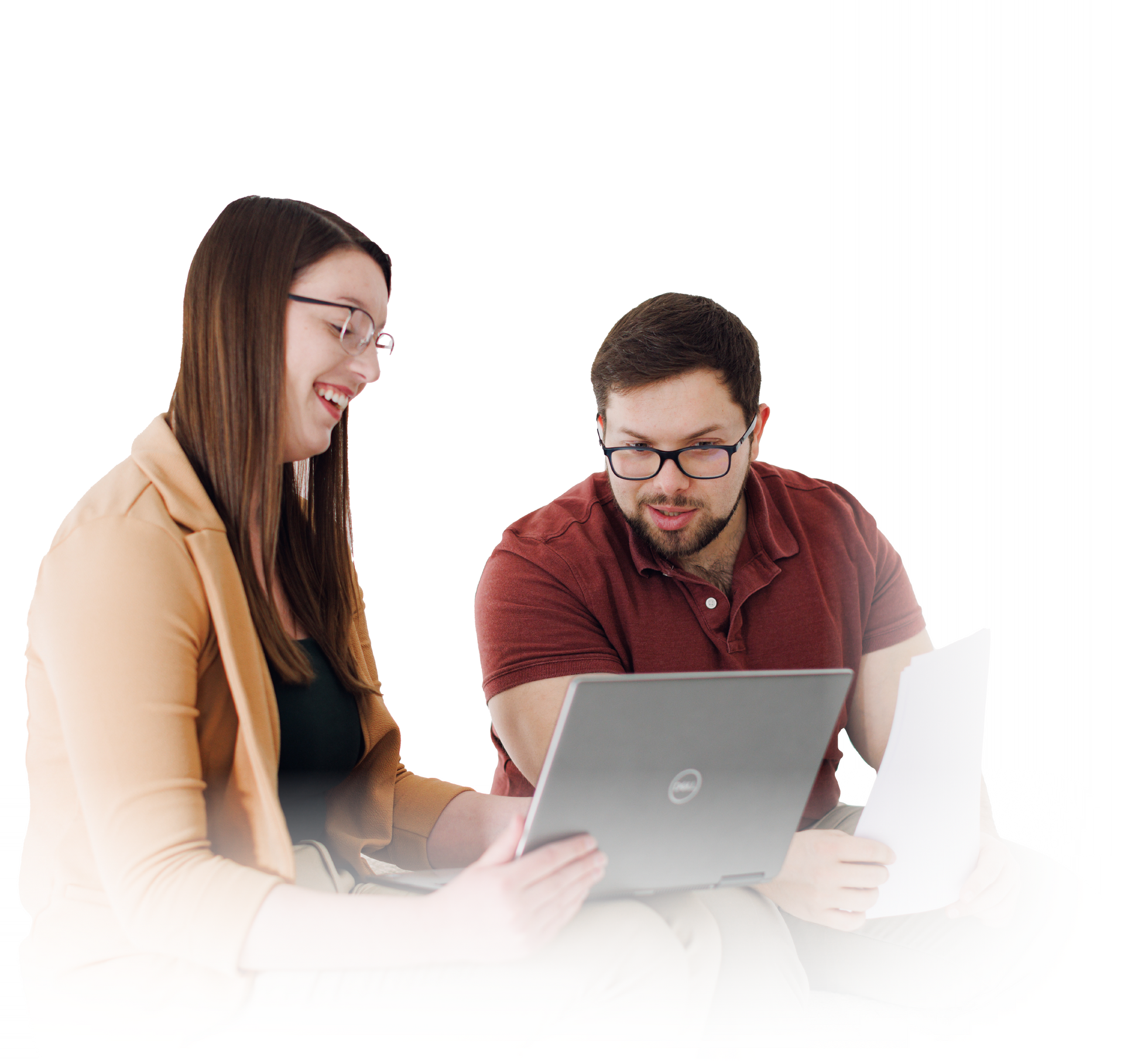Two people collaborating over a laptop in a bright, white office setting.