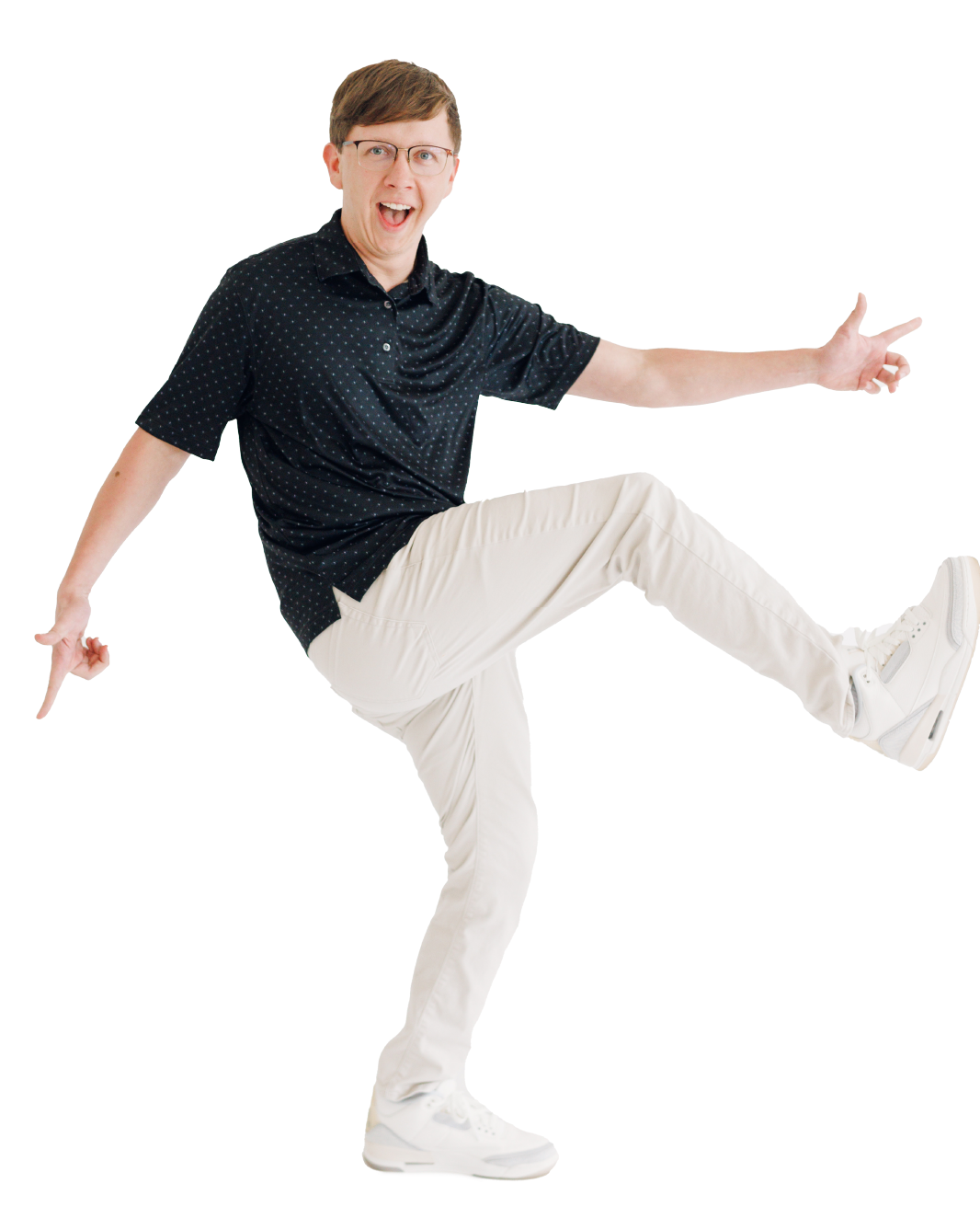 Person in black shirt and white pants posing playfully on a white background, one leg raised.