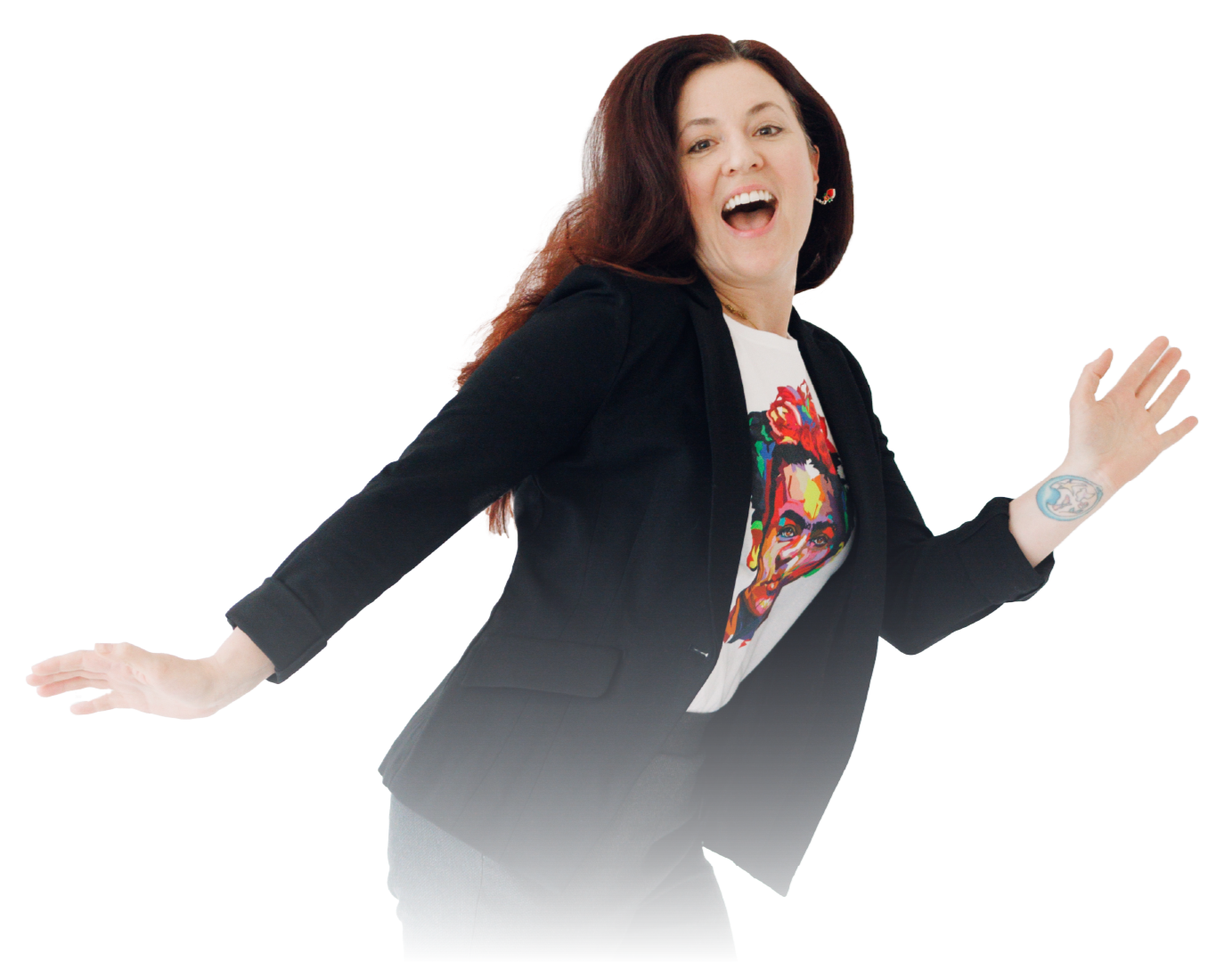 Smiling woman in black blazer and colorful shirt posing with arms outstretched on a white background