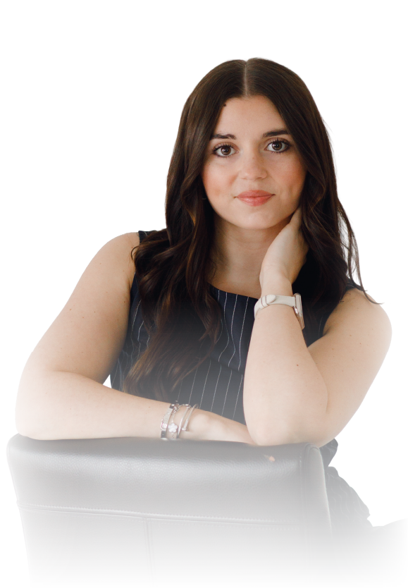Smiling person in a bright pink blazer against a white background