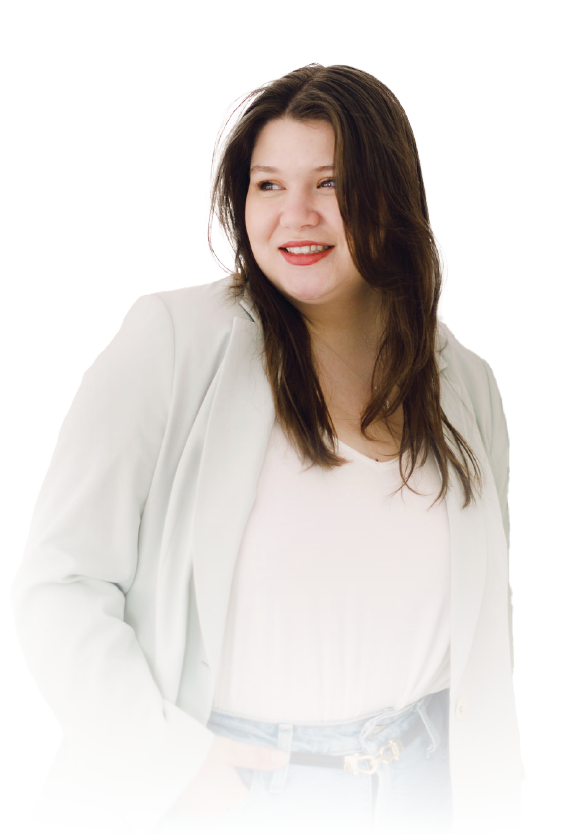 Woman in a white blazer and blouse, smiling and looking to the side against a white background