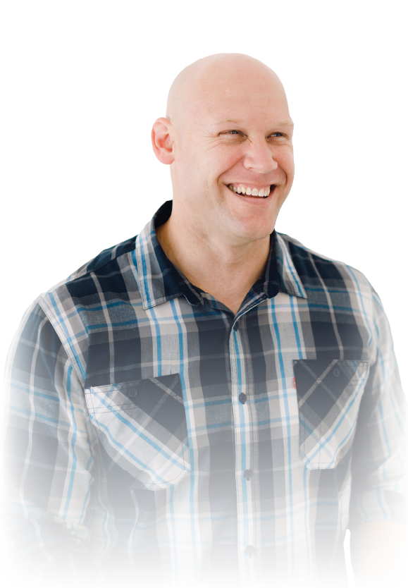 Smiling bald man in a blue plaid shirt on a white background