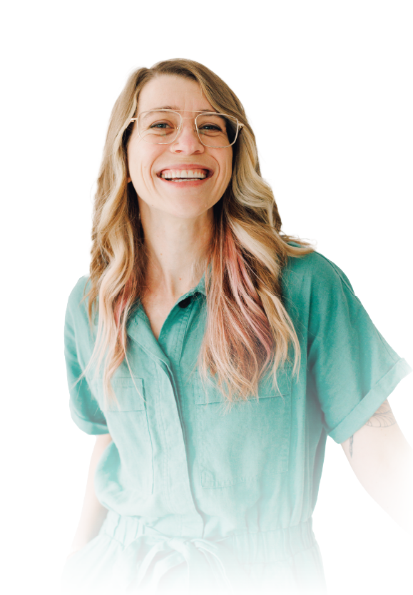 Smiling woman in a teal blouse against a white background