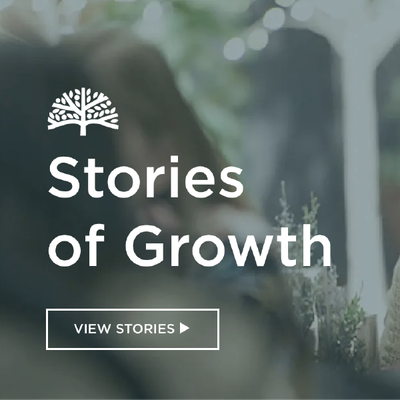 “Stories of Growth” promo with white text over a blurred green garden background and a “View Stories” button