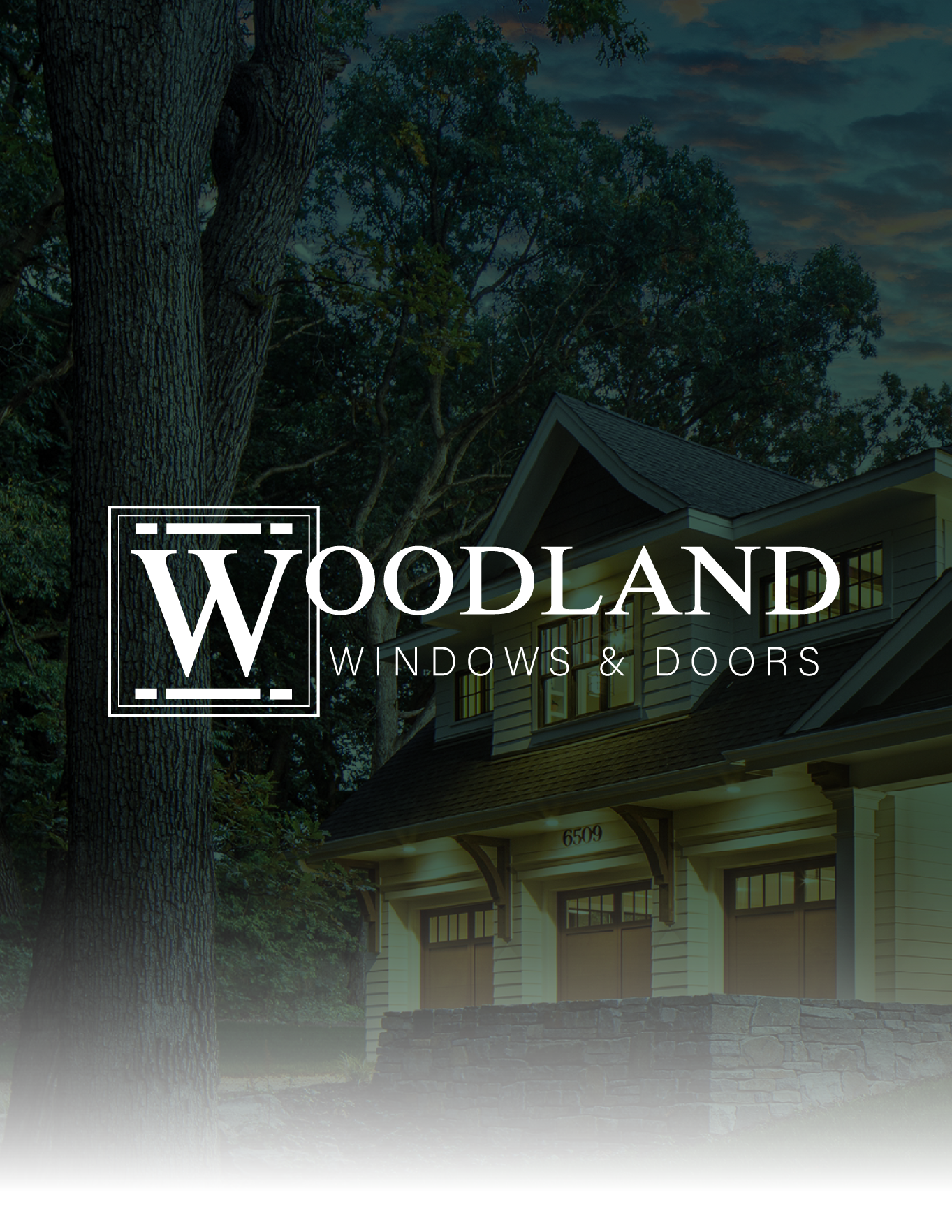Woodland Windows & Doors logo over a dark wooded house exterior at dusk