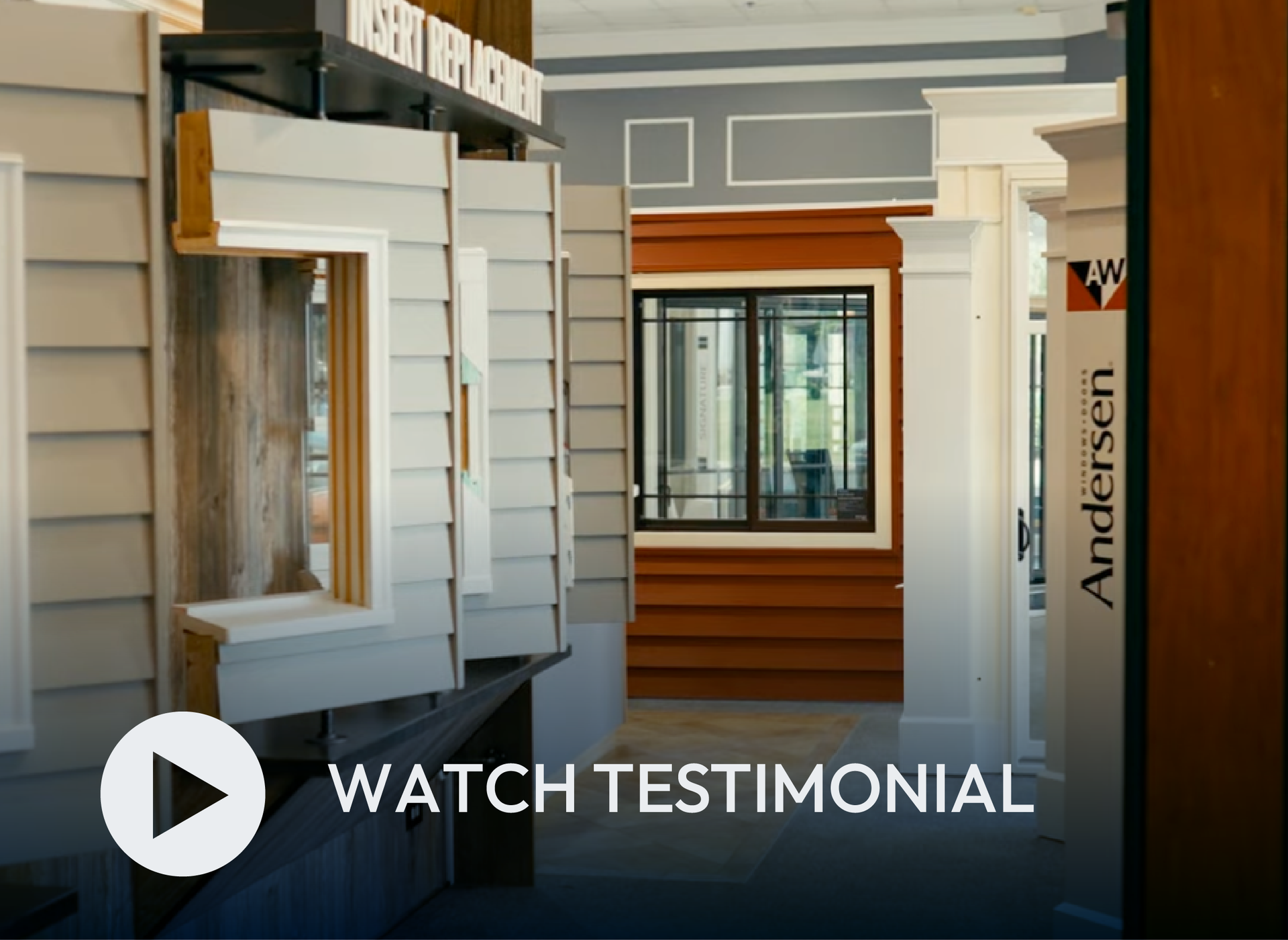 Showroom interior with sample siding displays and a “Watch Testimonial” play button overlay