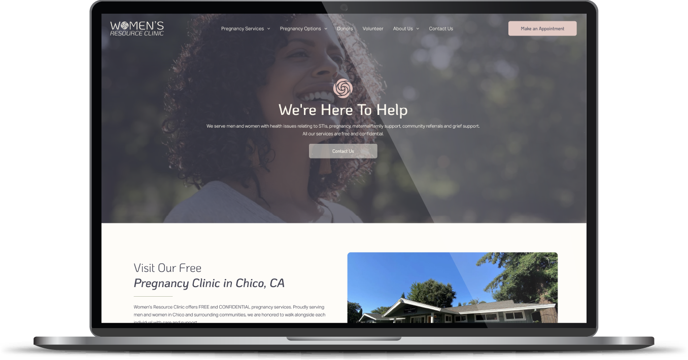 Laptop displaying a nonprofit website with a mountain background and “We’re here to help” headline