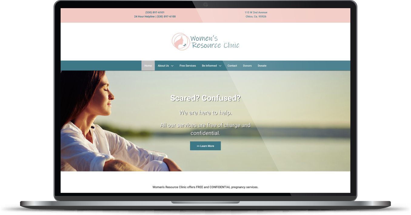 Laptop displaying a wellness website with a woman relaxing by the water at sunset