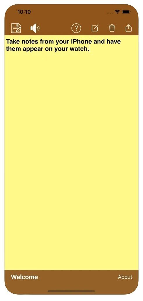 A cell phone with a yellow notepad on it.