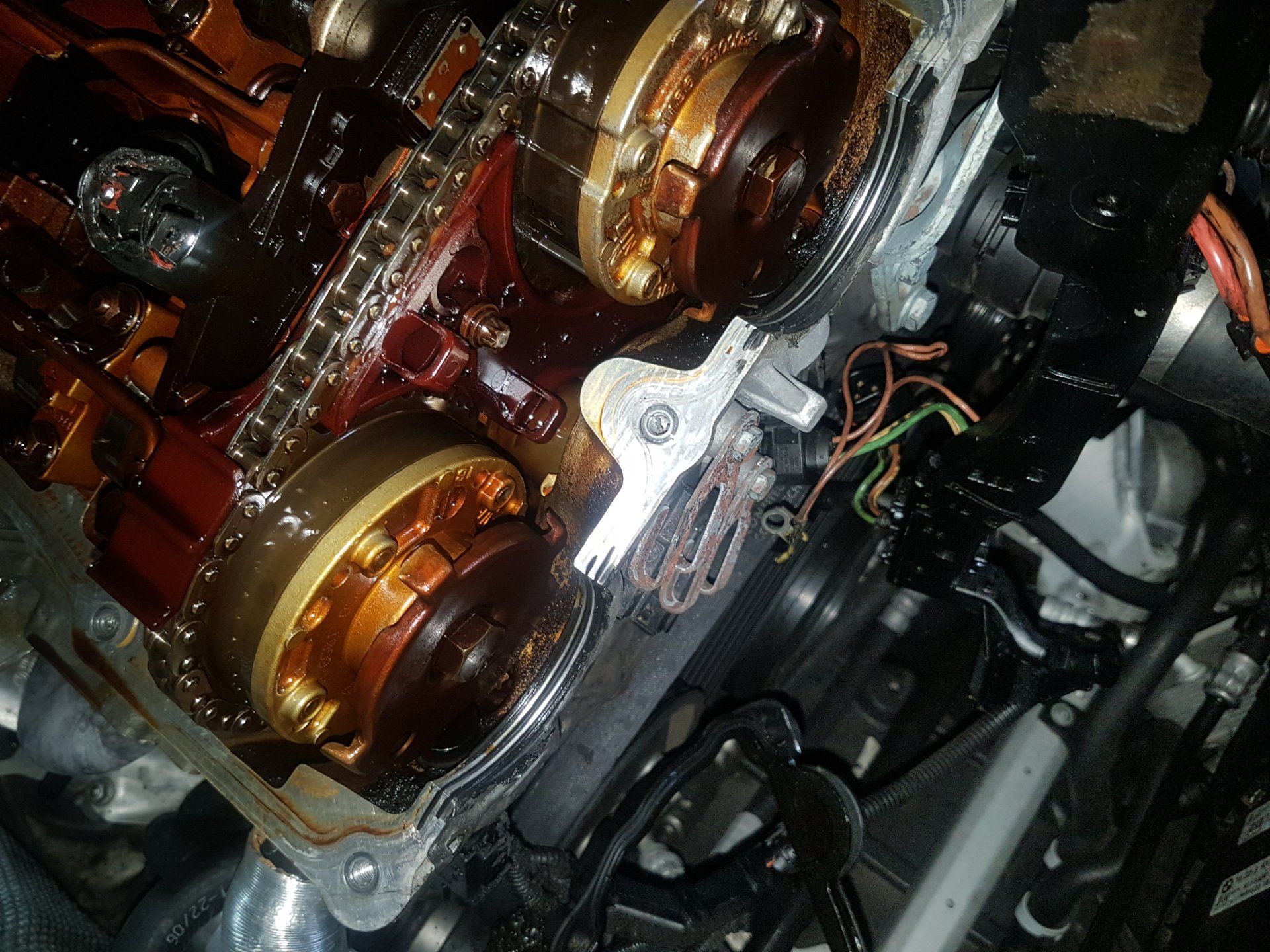 A close up of the inside of a car engine.