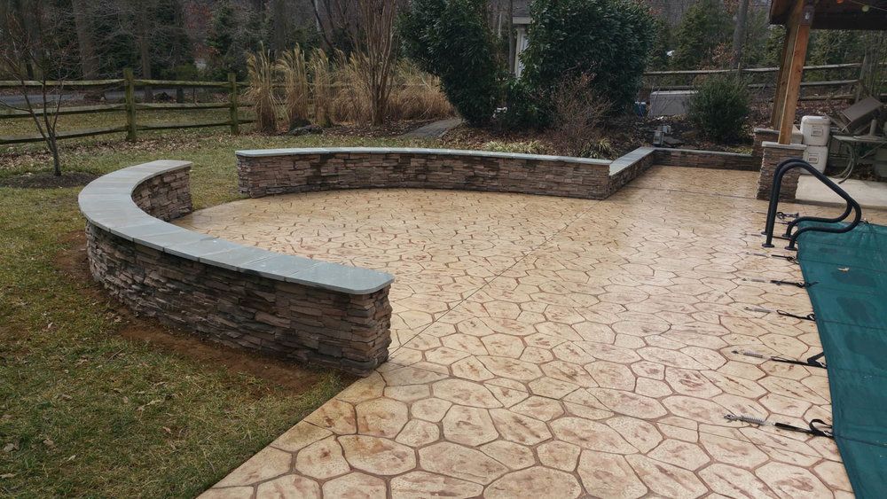 Custom retaining wall installed by J Gonzalez Construction in Maryland.