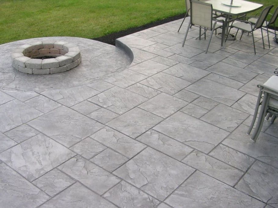 Paver Stone Outdoor Fireplace on an flagstone patio in Maryland installed by J Gonzalez Construction