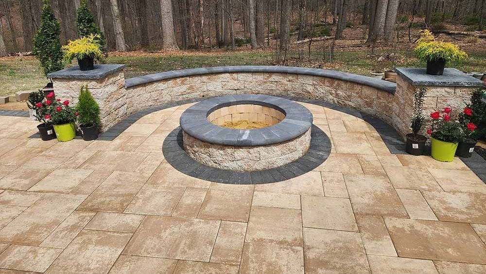 There is a fire pit in the middle of the patio.