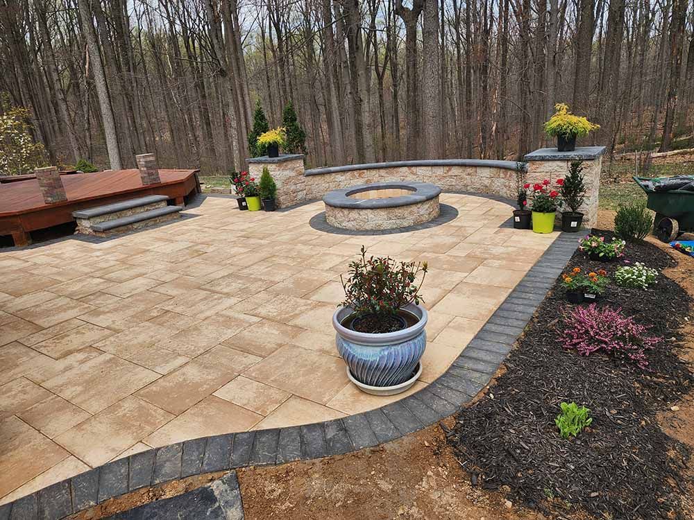 There is a fire pit in the middle of the patio.