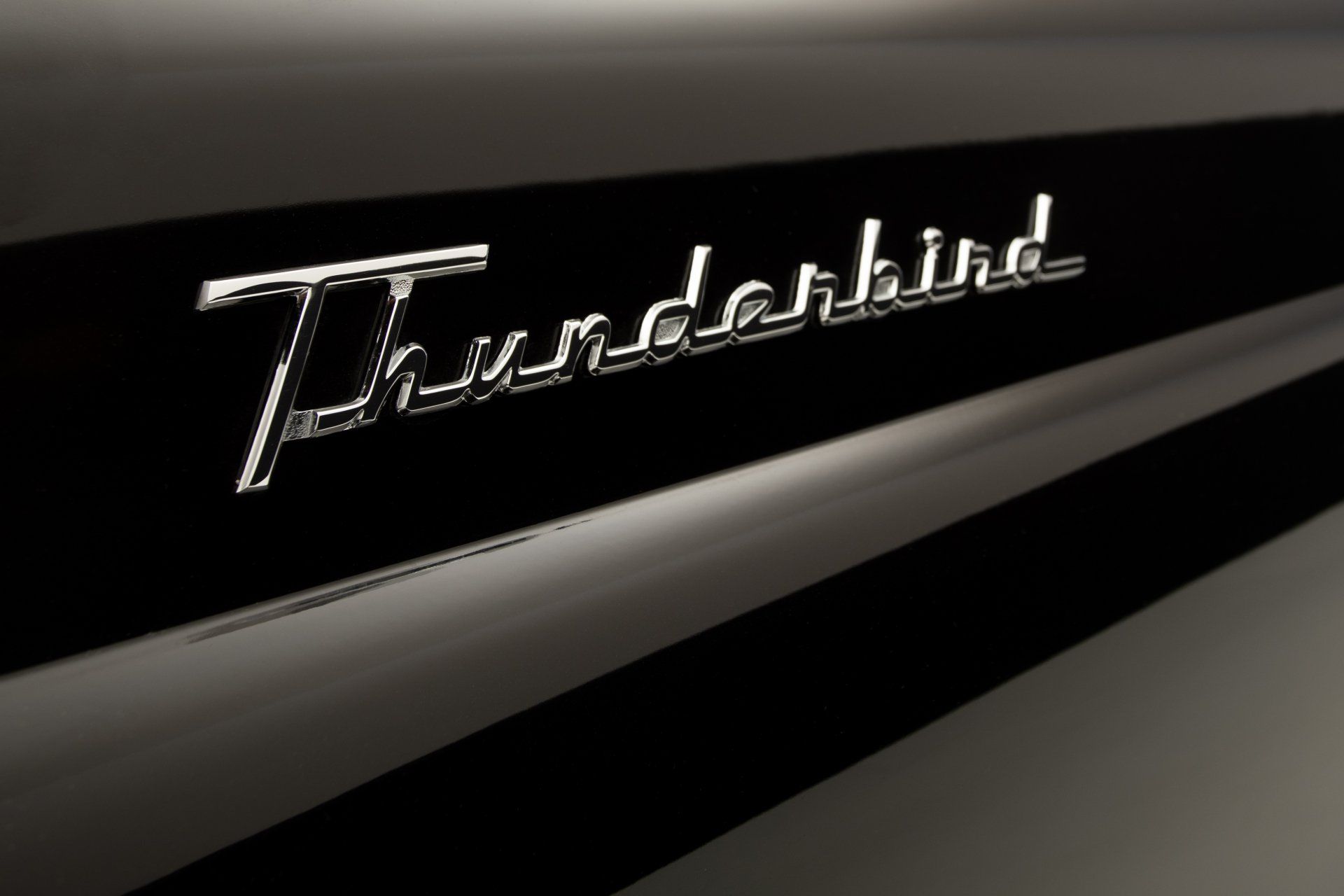 a close up of the word thunderbird on a car
