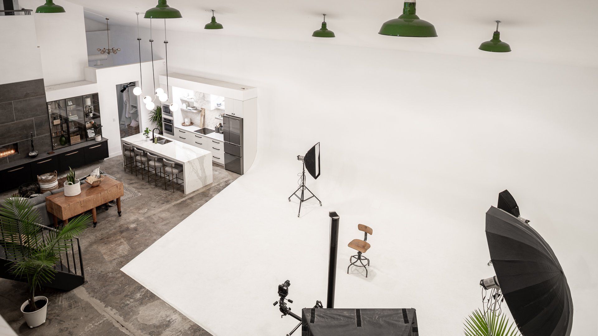 an aerial view of a photo studio with a white floor .