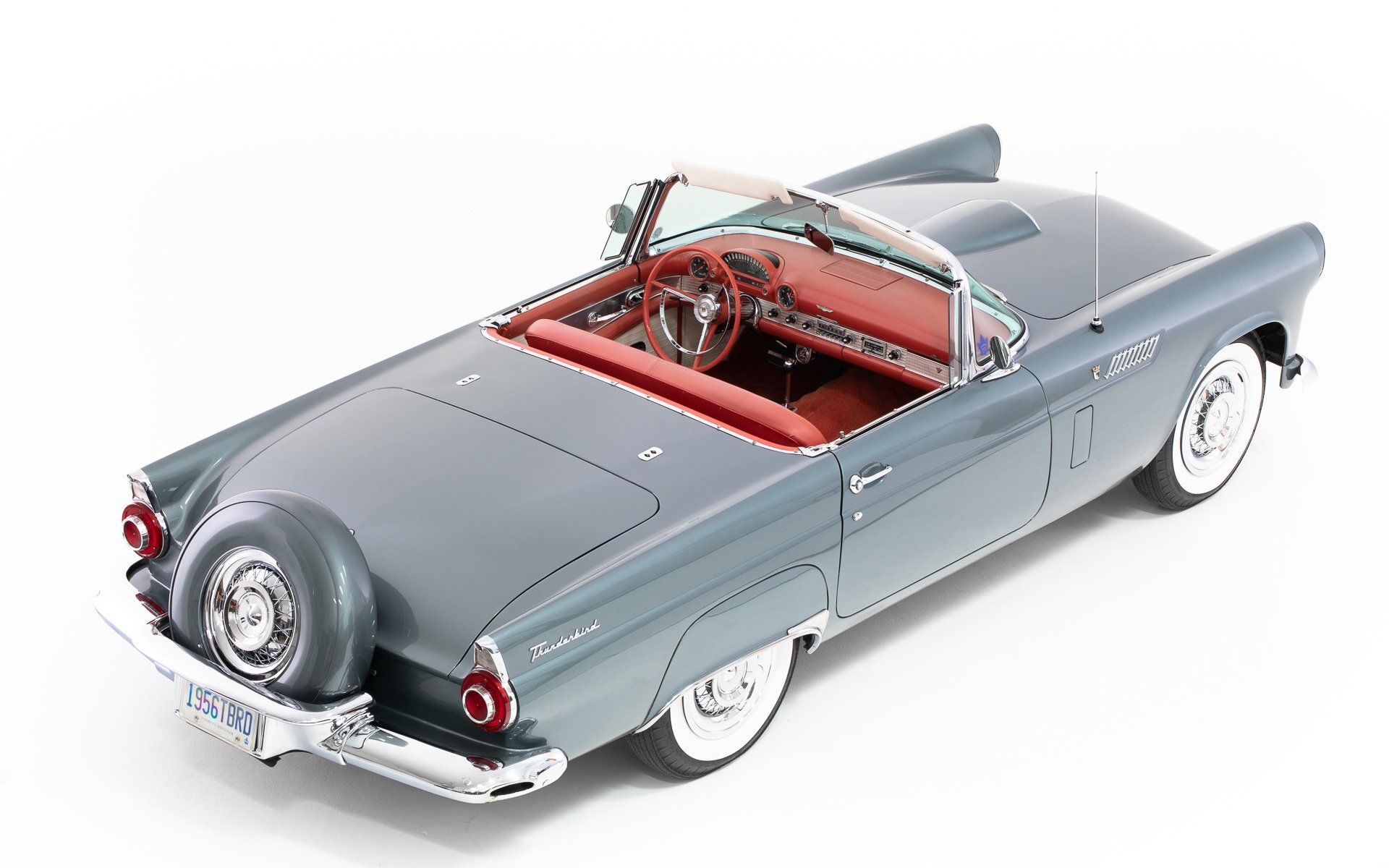 a model of a ford thunderbird convertible with a red interior