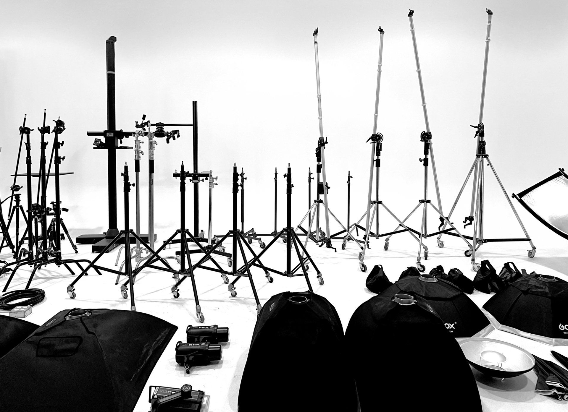 a black and white photo of a bunch of photography equipment