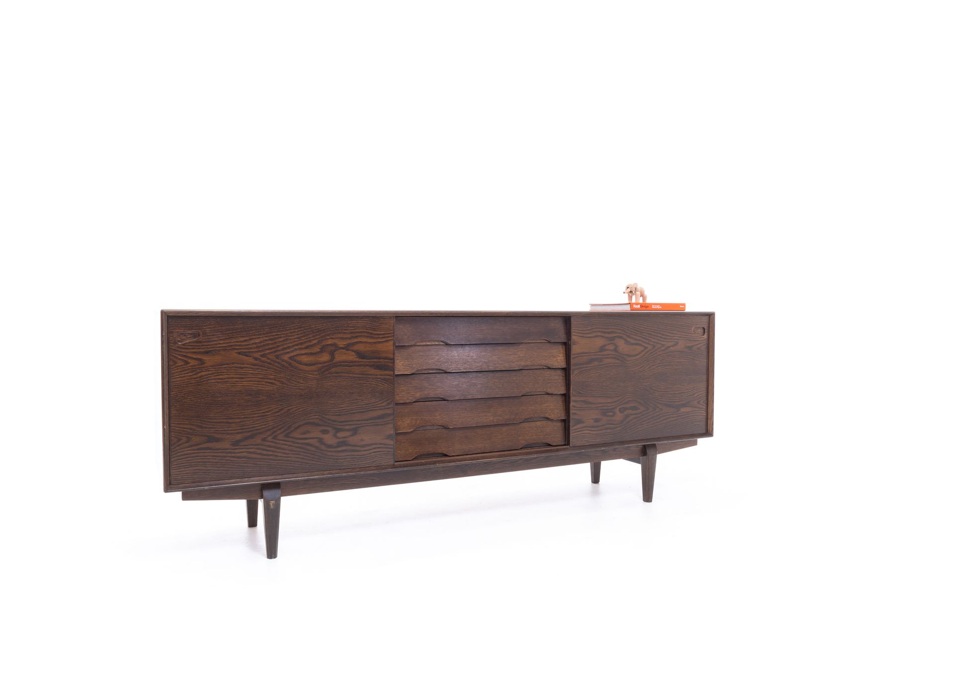 a wooden sideboard with drawers and doors on a white background .