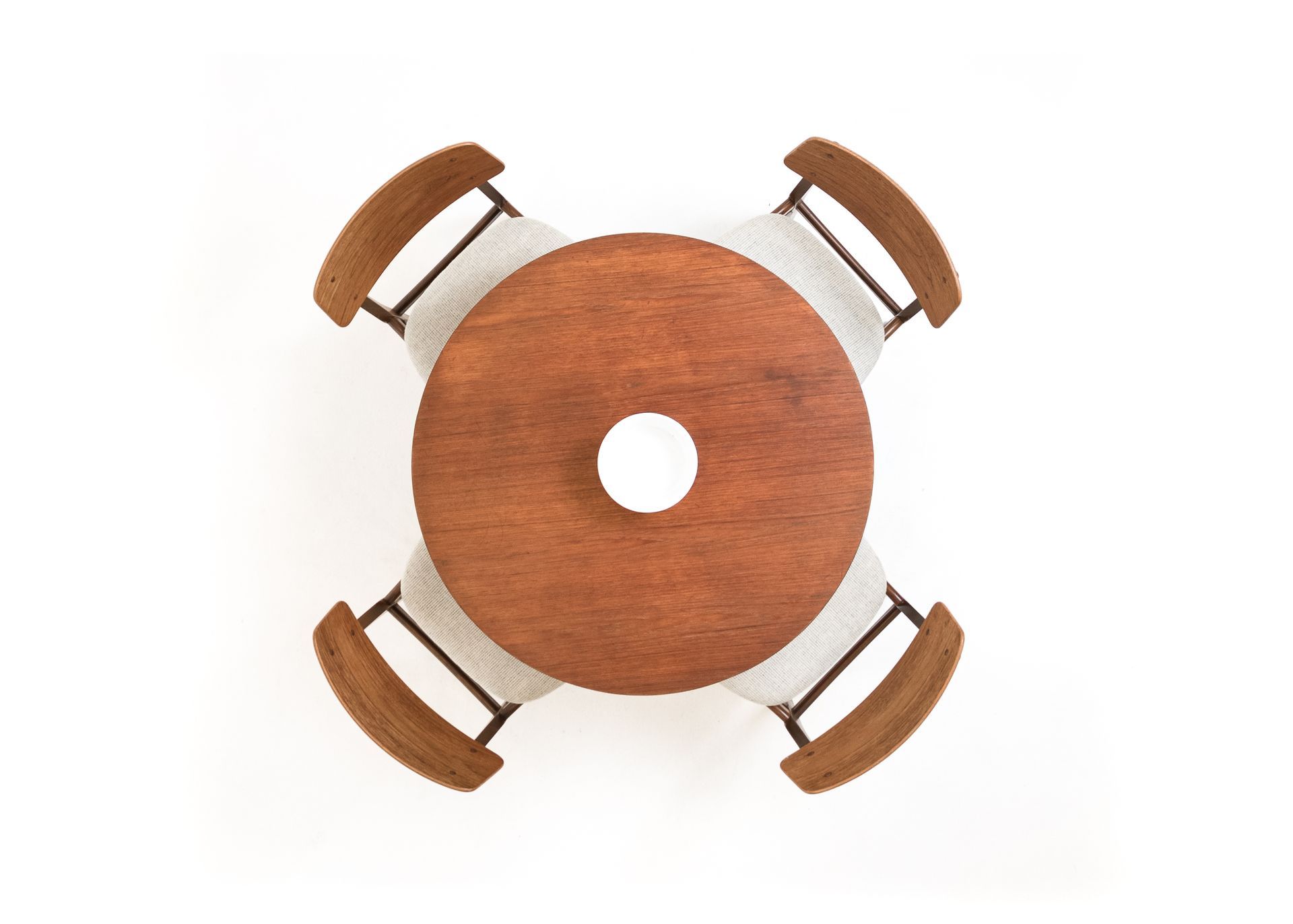 a wooden table with four chairs around it on a white background