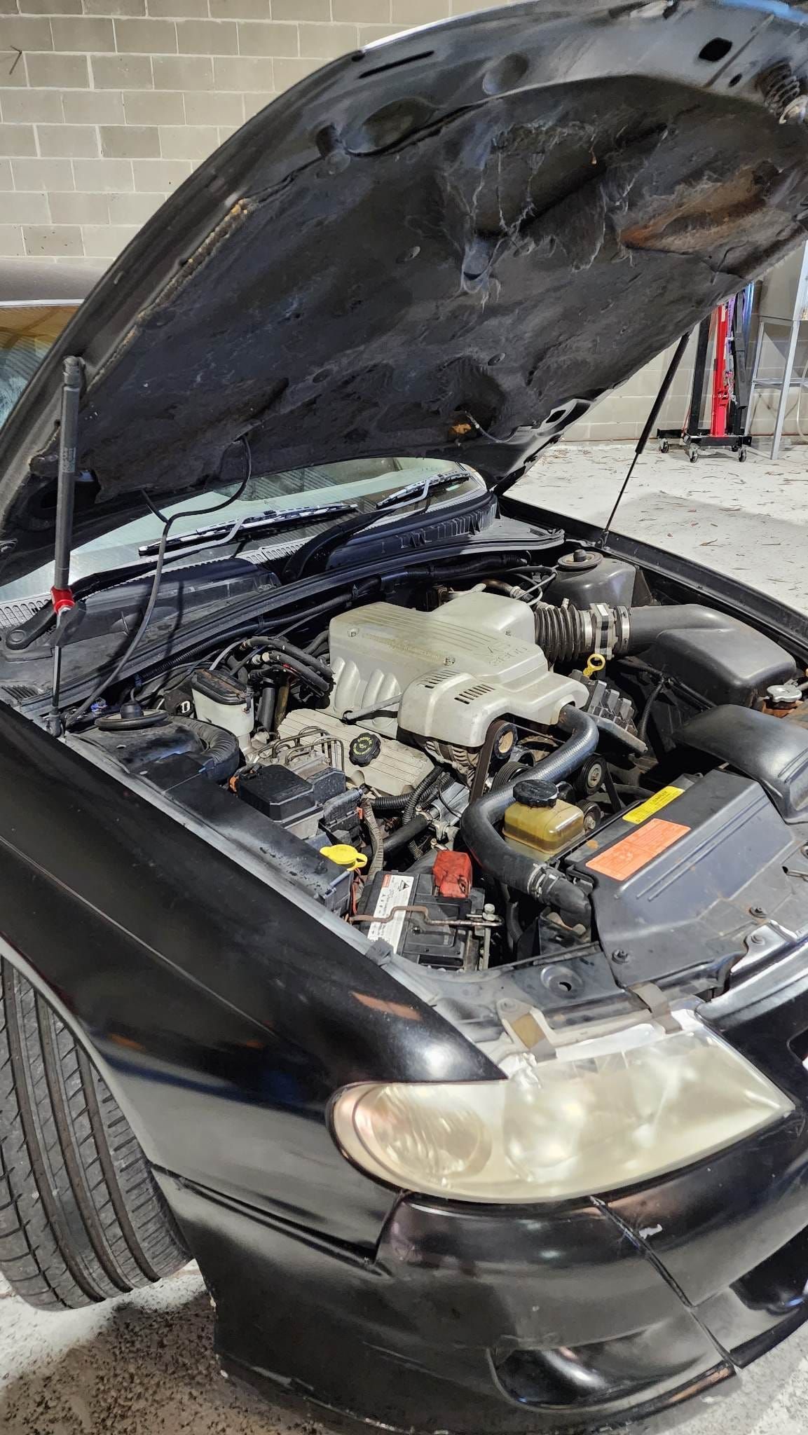 Donnellys Mechanical - Port Macquarie. A picture of a customer's vehicle being worked by Mechanics in Port Macquarie.