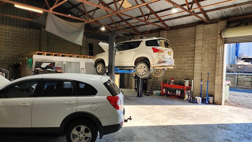 Donnellys Mechanical - Port Macquarie. A picture of a customer's vehicle being worked by Mechanics in Port Macquarie.