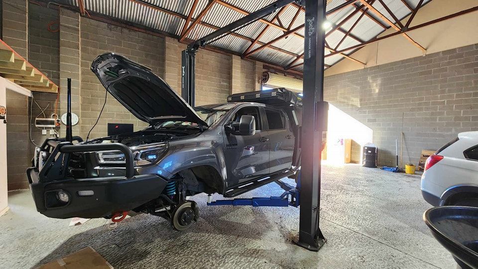 Donnellys Mechanical - Port Macquarie. A picture of a customer's vehicle being worked by Mechanics in Port Macquarie.