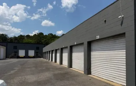 Parrish Drive drive-up storage with white roll-up doors and warehouse loading docks, Rome GA