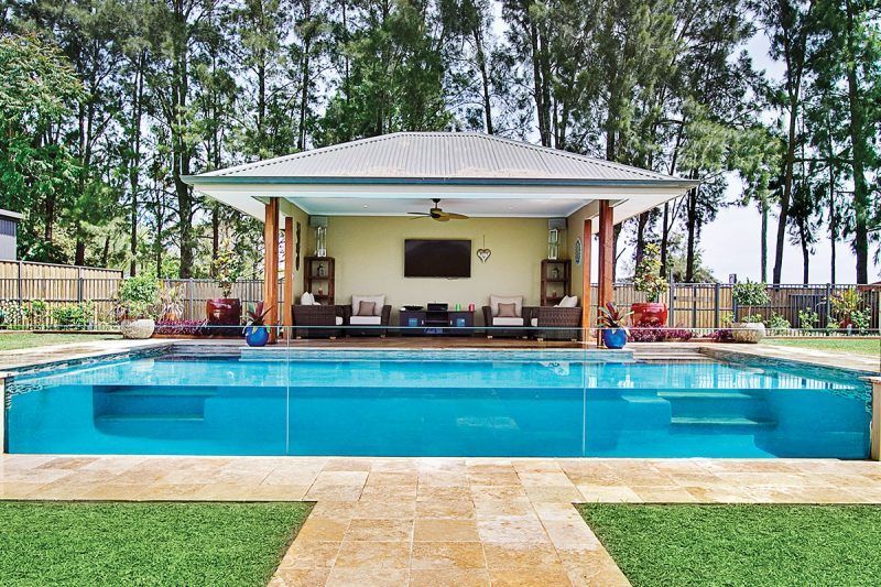 A Large Swimming Pool With A Gazebo In The Background — Glass Pool Windows Australia In Old Bar, NSW